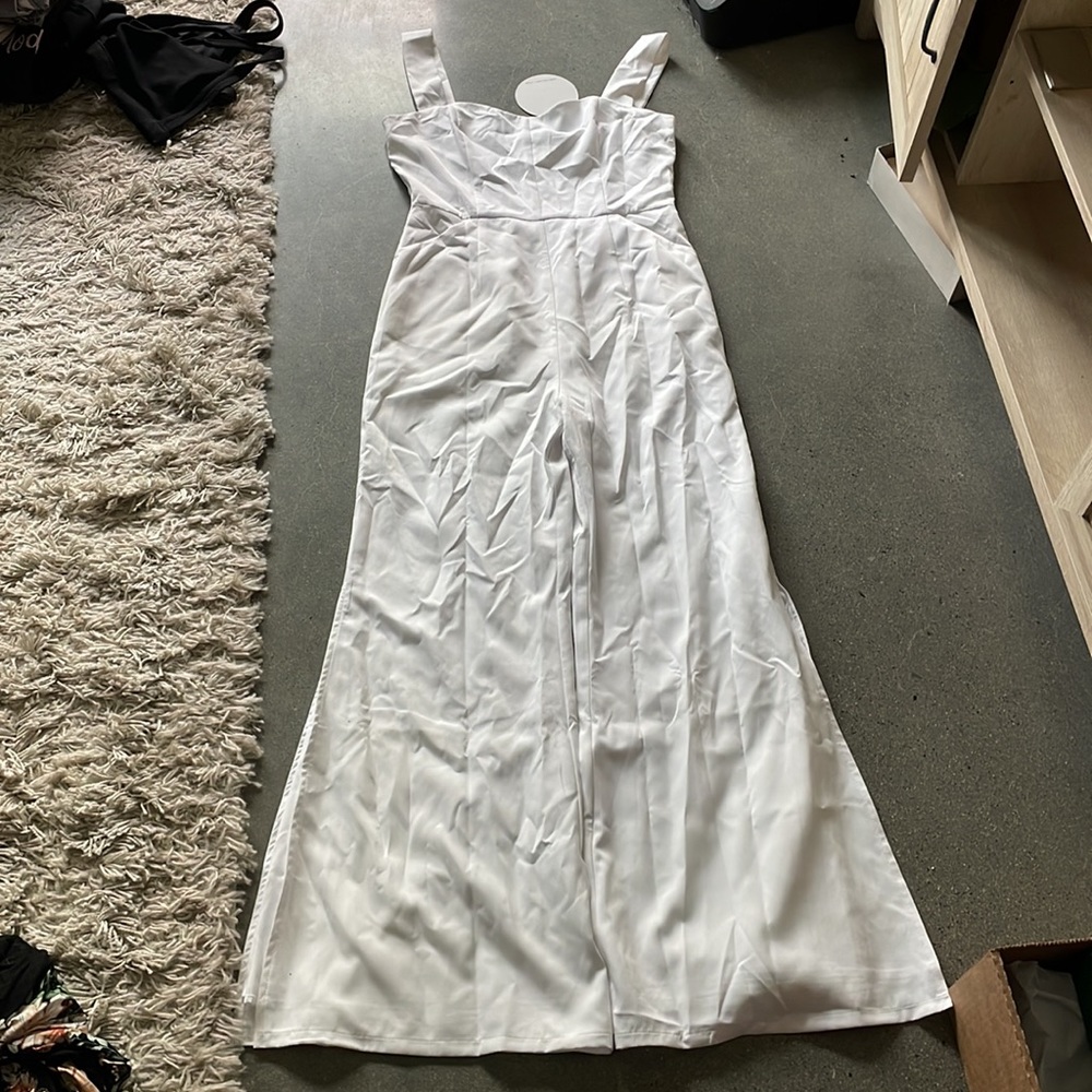 White, flared bottom, jumpsuit never worn